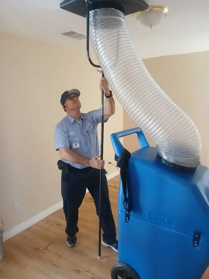 Furnace Tune-Up technician using HEPA equipment in North Riverside